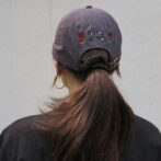 the model is wearing the cap