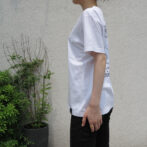 the model is wearing the white t-shirt