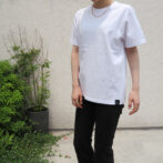 the model is wearing the white t-shirt