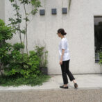 the model is wearing the white t-shirt