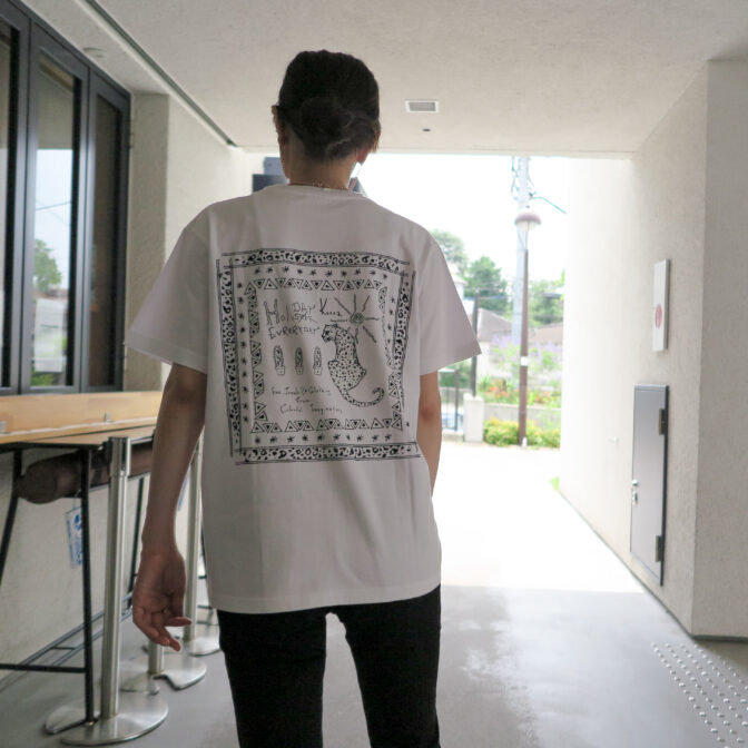 the model is wearing the white t-shirt