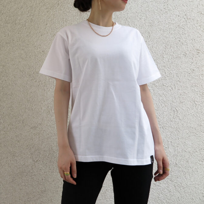 the model is wearing the white t-shirt