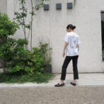 the model is wearing the white t-shirt