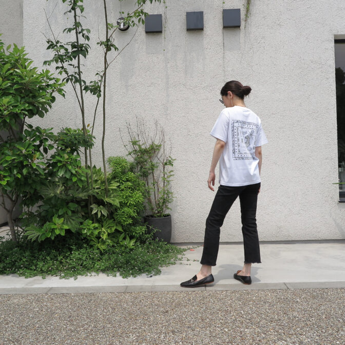 the model is wearing the white t-shirt