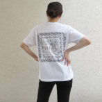 the model is wearing the white t-shirt