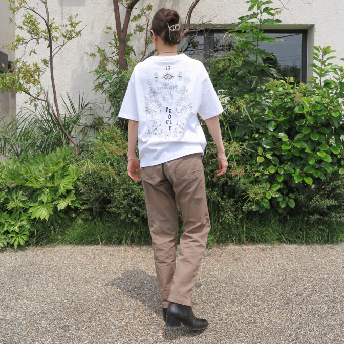 the model is wearing a white shirt