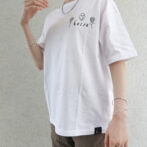 the model is wearing a white shirt