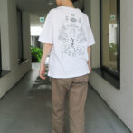 the model is wearing a white shirt