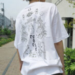 the model is wearing a white shirt