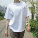 the model is wearing a white shirt