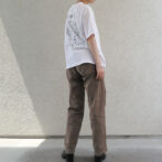 the model is wearing a white shirt