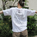 the model is wearing a white shirt